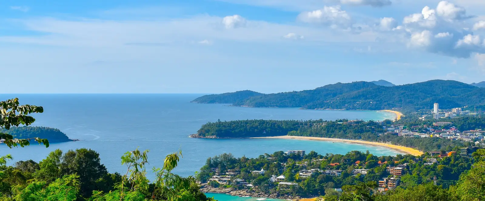 Kata Yai Beach from above: longtail boats and swimmers · Radek Kucharski, CC BY 2.0